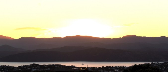A sailboat under the New Year sunrise over Wellington.